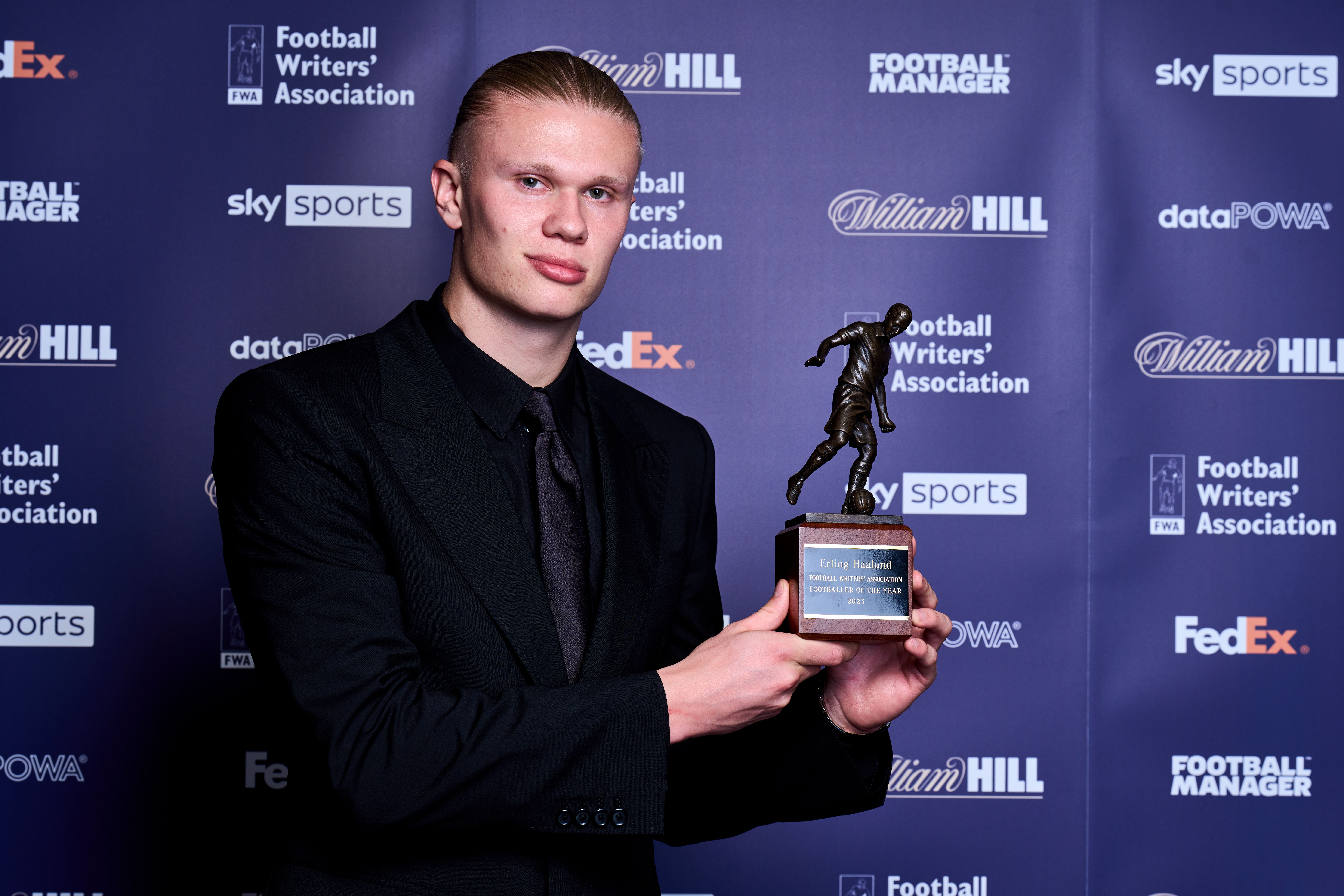 Dressed up to receive the FWA Premier League Player of the Year trophy Harland: Will do my best to win two finals for Manchester City