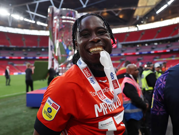 Luton Town defensive midfielder Pelly-Ruddock Mpanzu becomes the first and only player in English football history to have won promotion from non-league all the way to the Premier League with the same club..