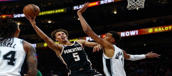 With 26 points and 12 rebounds, the Spurs defeated the Hawks 126-98.